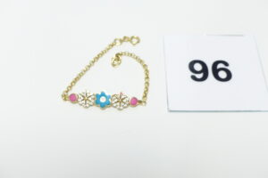 1 Bracelet en or 750/1000 (18K) motif central à décor floral serti de petites pierres et motifs émaillés (1 chaton vide, Longueur 14cm). PB 3,5g
